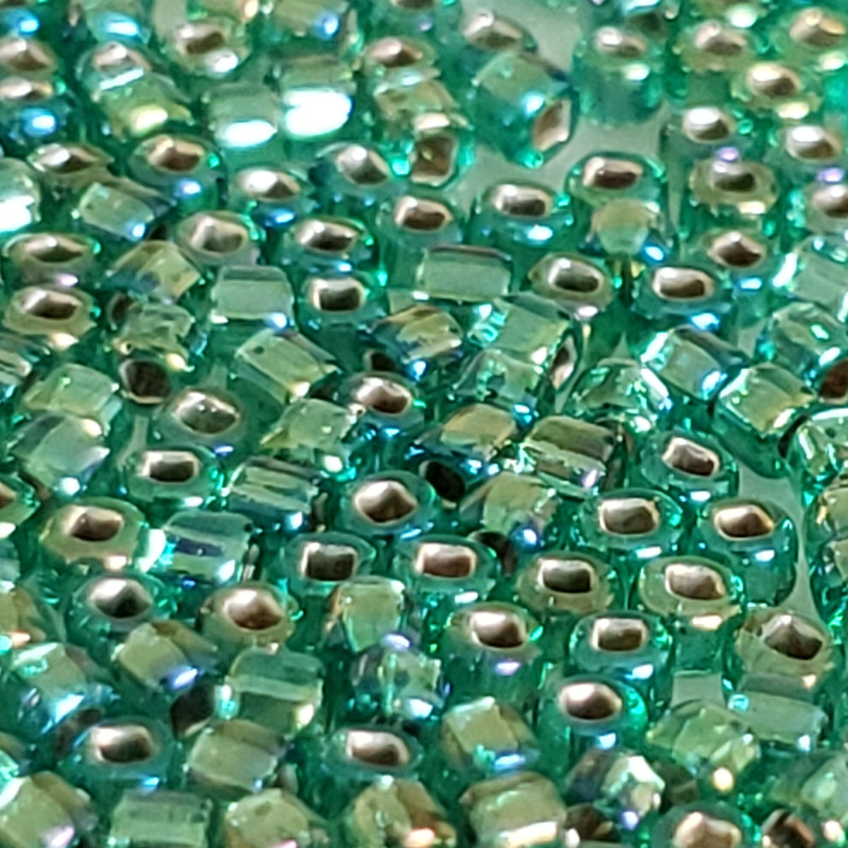 11/0 Round Toho sea green ,seed beads 27 gms. Approximately 2530 beads