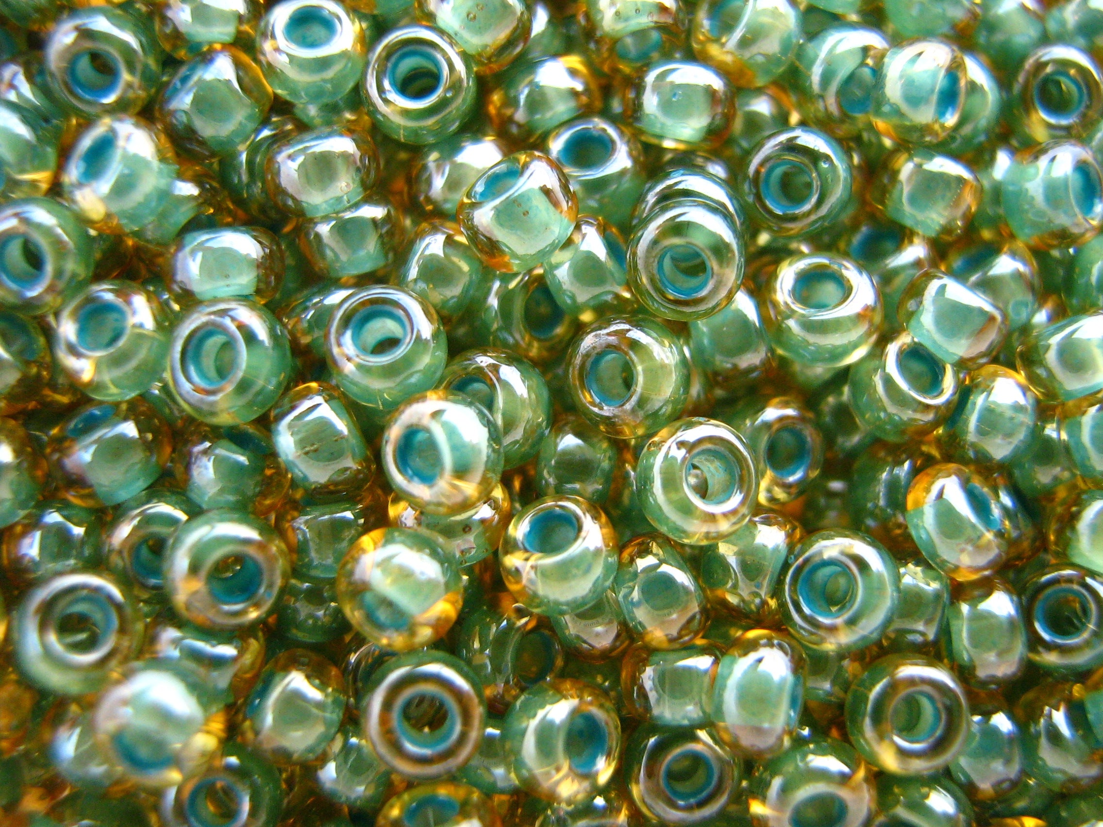 11/0 round Toho Seed Beads Amber lined  16gms.
