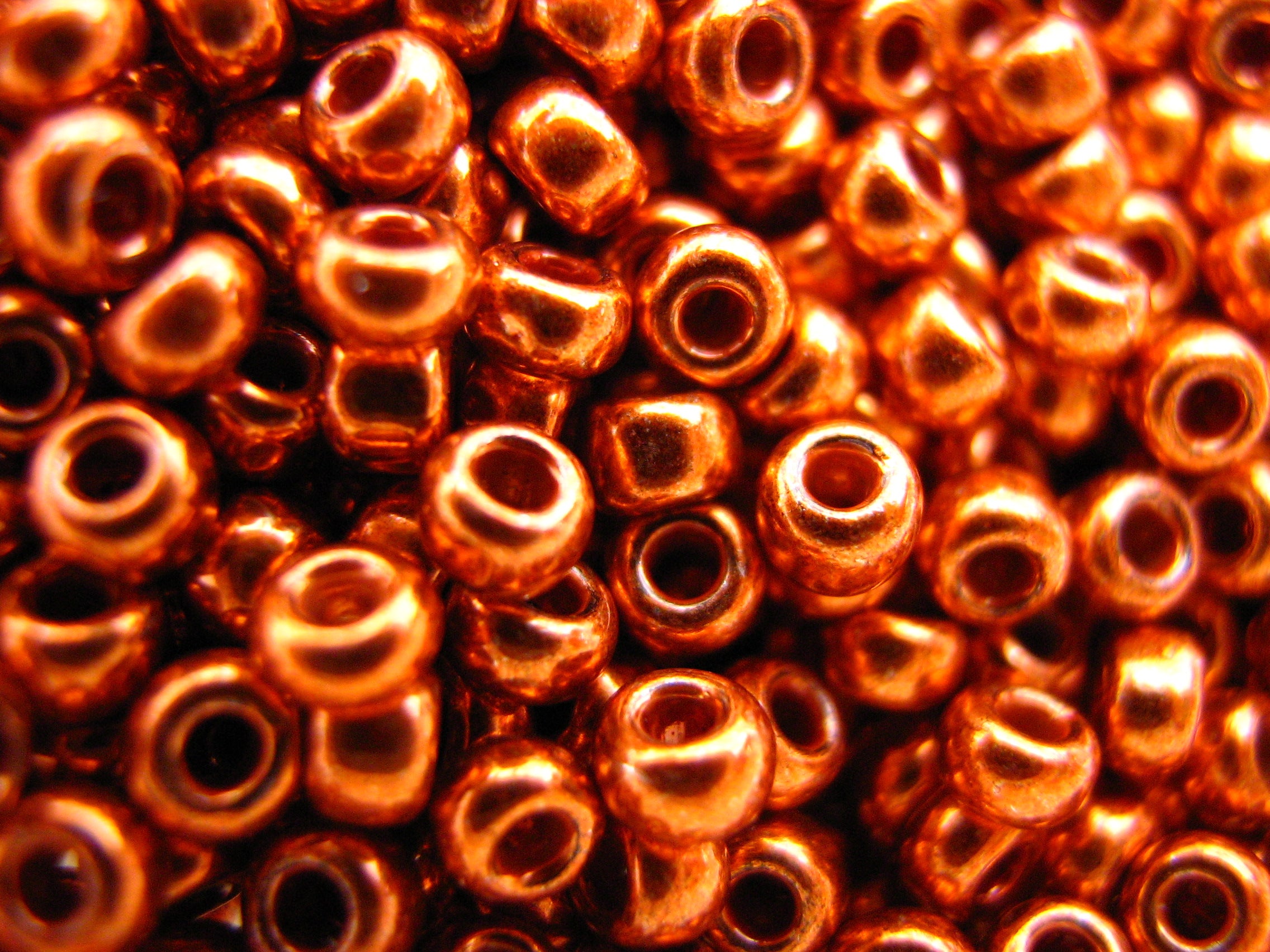 11/0 Toho Seed Beads 16gms Pumpkin orange galvanized.
