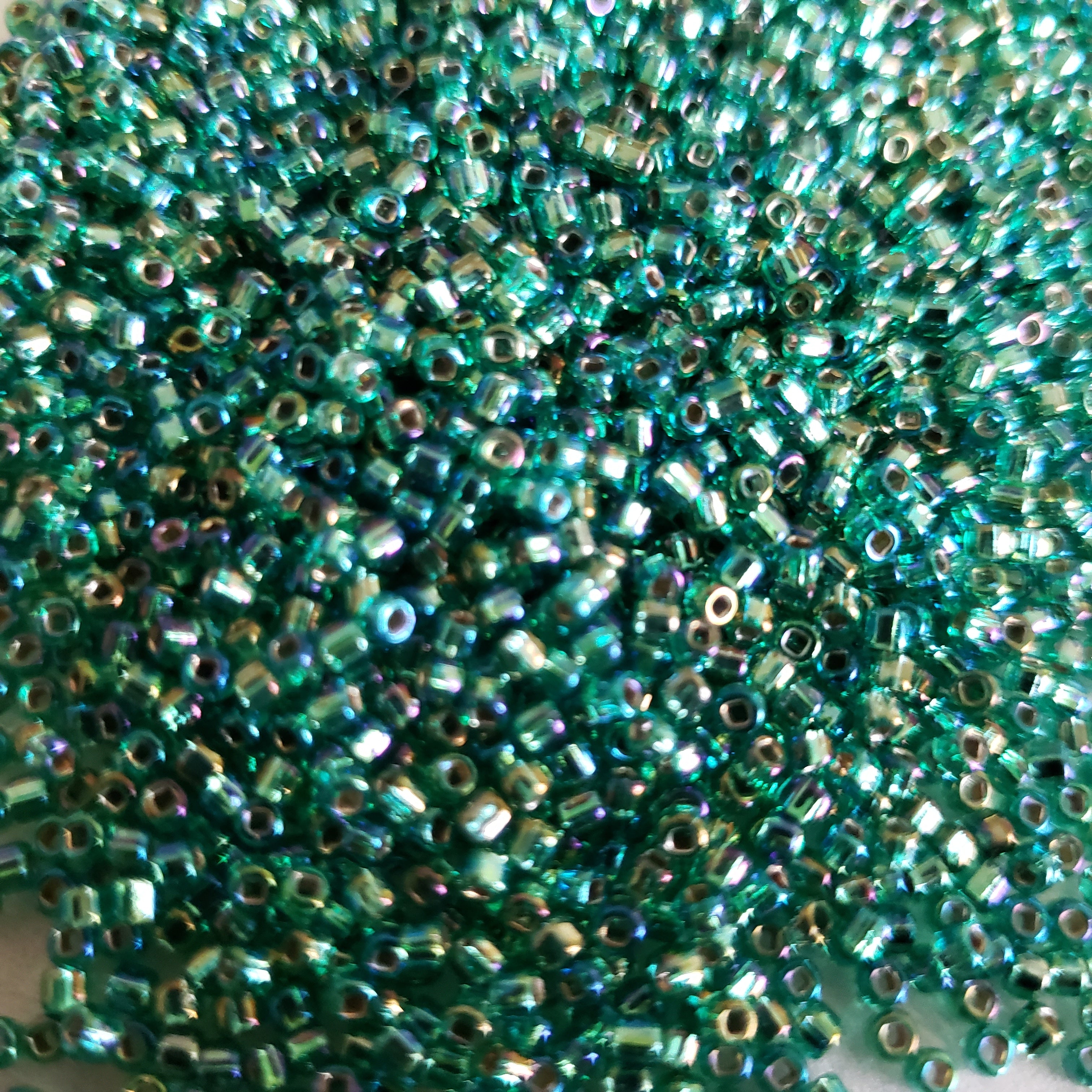 11/0 Round Toho sea green ,seed beads 27 gms. Approximately 2530 beads per bag.